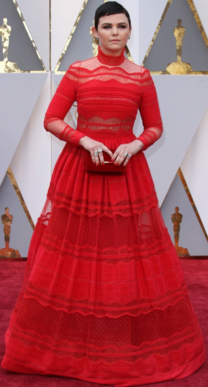 Ginnifer Goodwin exuded elegance at the 2017 Oscars in a red lace Zuhair Murad gown, complete with intricate sheer details and a regal high neckline