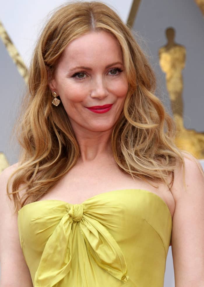 Leslie Mann styles her blonde locks in soft, tousled waves, perfectly complementing her fairytale-inspired Oscars look