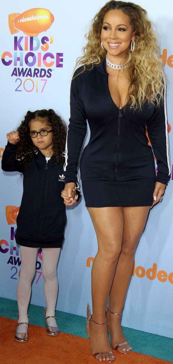 Mariah Carey and daughter Monroe wearing matching striped Adidas mini dresses and Sophia Webster "Chiara" rose gold shoes at the 2017 Kids' Choice Awards
