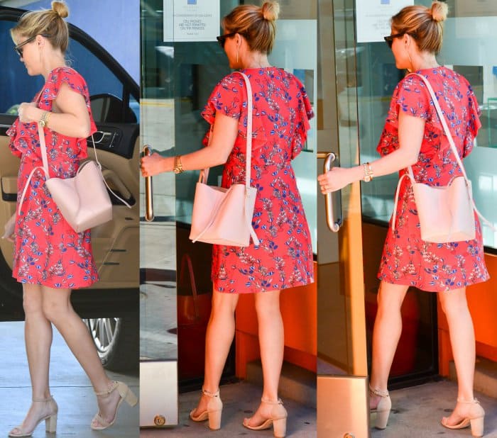 Reese Witherspoon wearing the Dunaway Vines Ruffle Knit Dress from Draper James and nude ankle-strap sandals