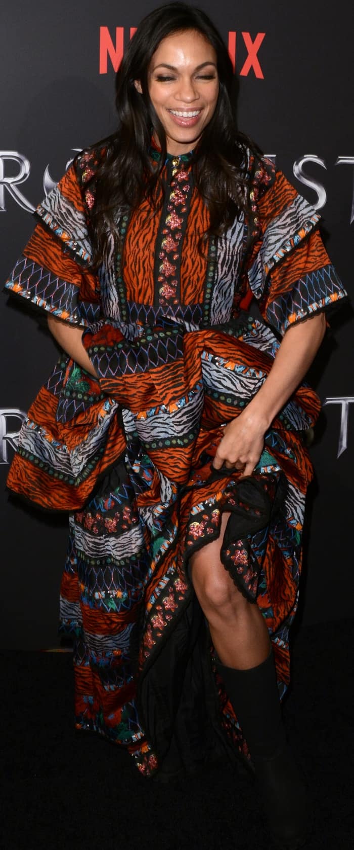 Rosario Dawson wearing a Kenzo x H&M patterned maxi dress at the New York screening of Marvel's "Iron Fist"