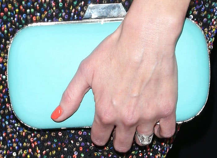 Alexis Bledel inserts a pop of color into her outfit with a tiffany blue Lili Radu clutch