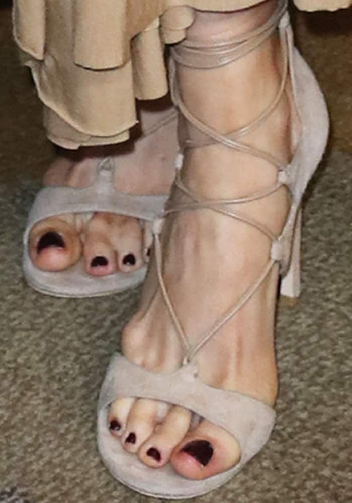 Bellamy Young shows off her feet in Stuart Weitzman "Legwrap" sandals