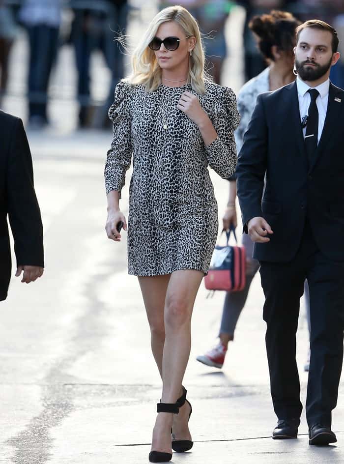 Charlize Theron wearing a puffed-sleeve leopard dress for an appearance on Jimmy Kimmel Live in Los Angeles on April 14, 2017