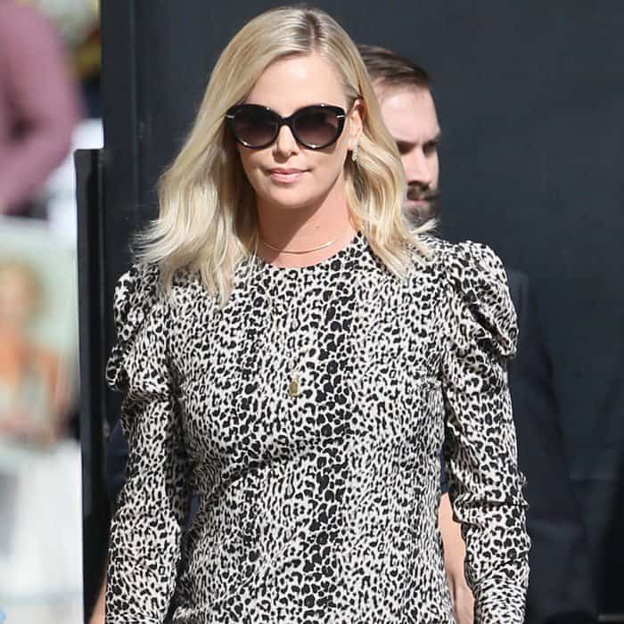 Charlize Theron wearing a puffed-sleeve leopard dress for an appearance on Jimmy Kimmel Live in Los Angeles on April 14, 2017