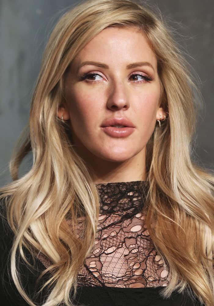 Ellie Goulding's outfit featured a Saint Laurent mini dress with a distinctive mix of distressed lace and mesh at Omega's "Lost In Space" anniversary party