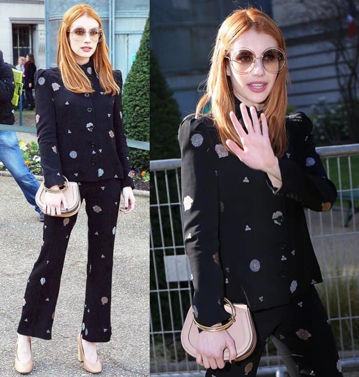 Emma Roberts looked effortlessly chic at the Chloé show in a playful printed black pantsuit, nude pumps, and oversized sunglasses, perfectly accessorized with a Chloé Nile bag