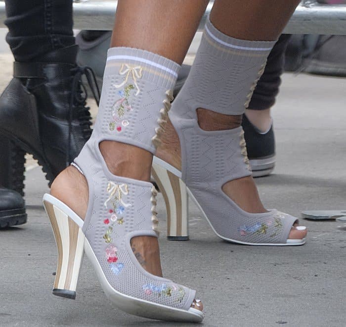 Kelly Rowland wearing stretch-knit ankle sock boots from Fendi