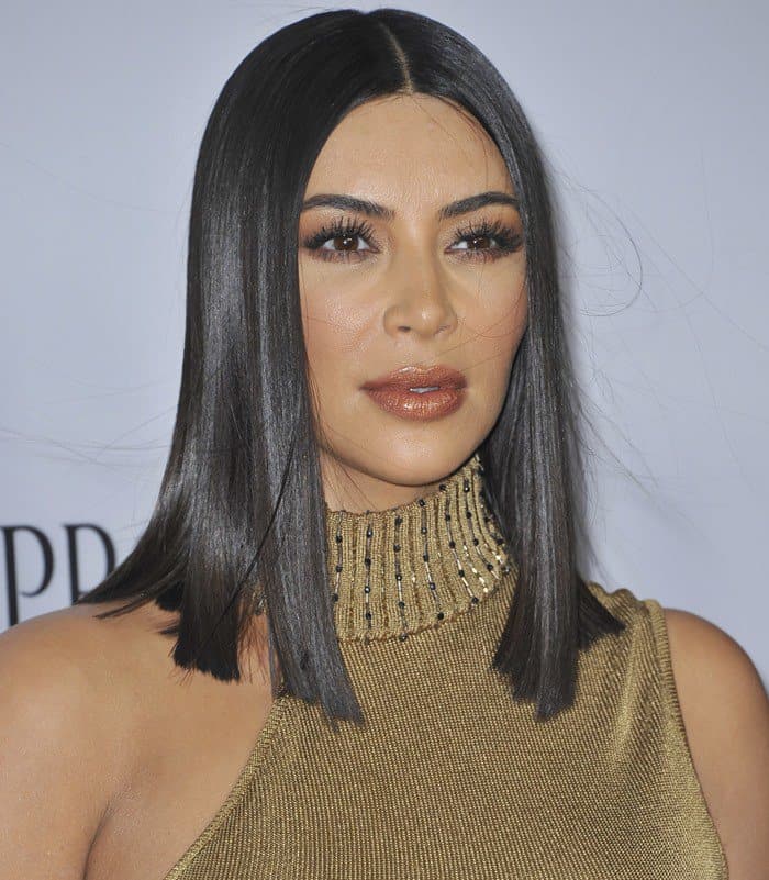 Kim Kardashian Highlights Curves in Gold Gianni Versace Knit Dress