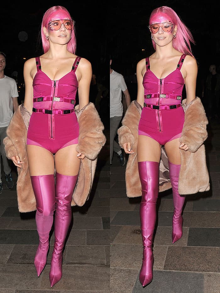Pixie Lott wearing a pink superhero-inspired outfit with pink Balenciaga spandex thigh-high boots for a secret gig as part of the "Sink The Pink" club night at The Clapham Grand in London, England, on April 14, 2017.