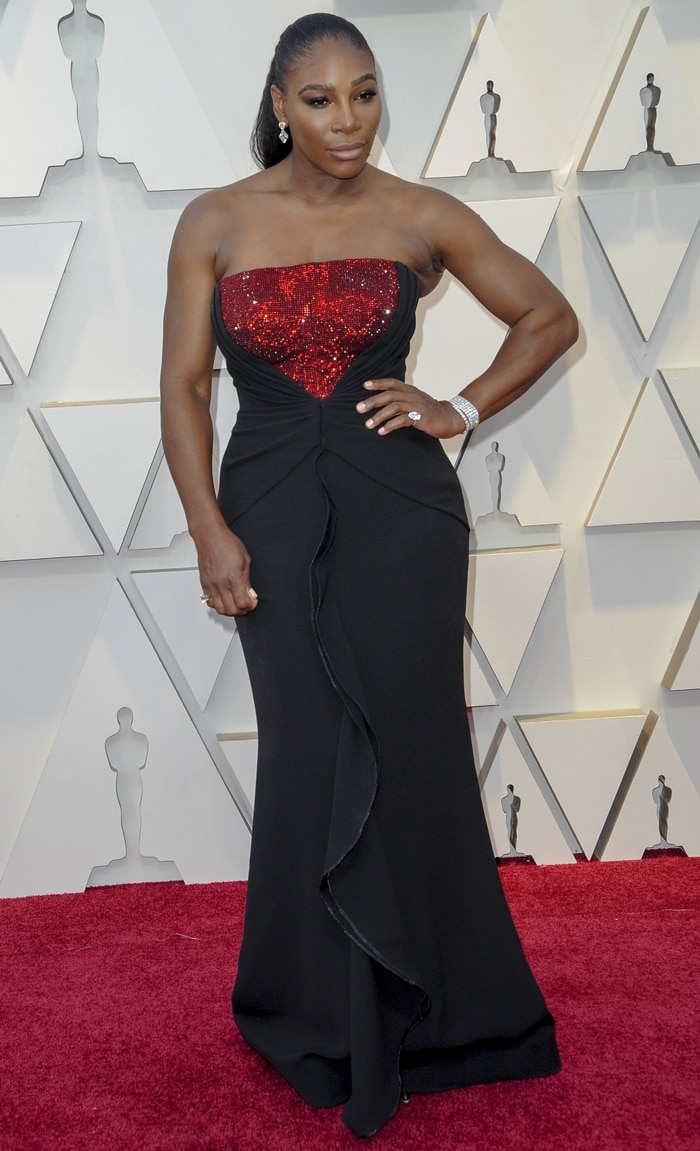 Serena Williams stuns in a sparkling red and black Armani Privè gown at the 2019 Academy Awards