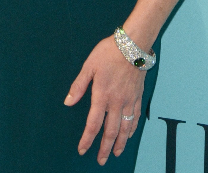 Reese Witherspoon showcased a dazzling Tiffany & Co. diamond cuff bracelet, highlighted by a striking emerald centerpiece, at the Blue Book Gala