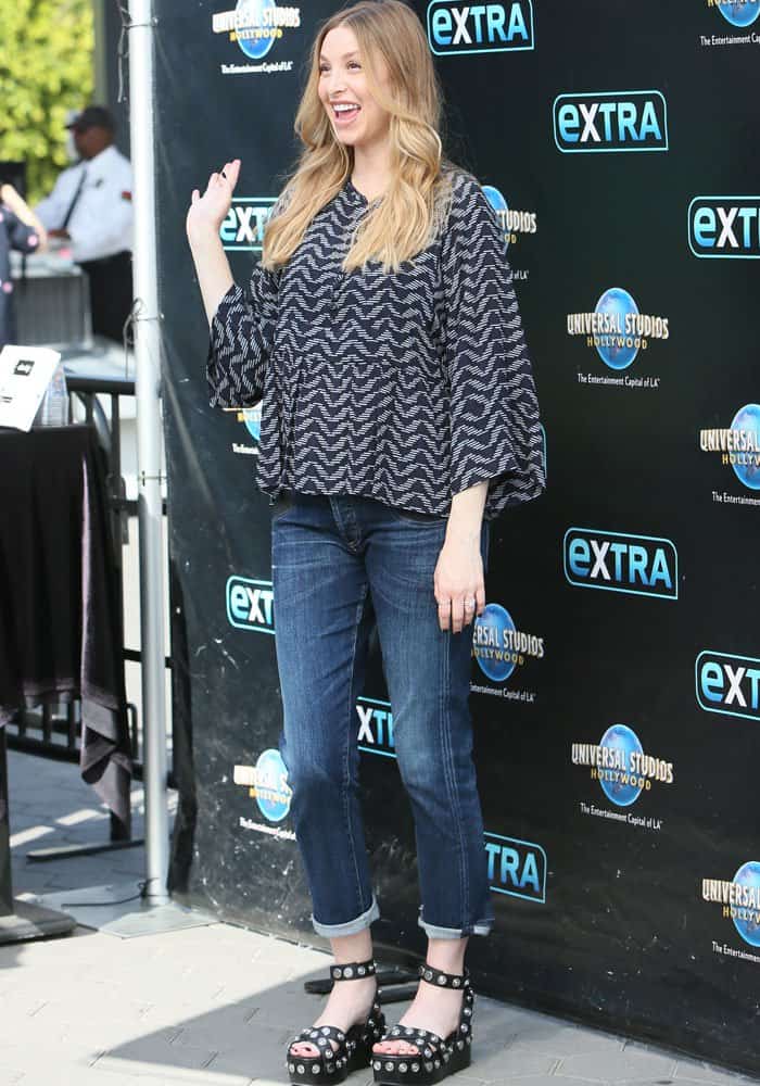 Whitney Port keeps her pregnancy look casual in a loose top and jeans