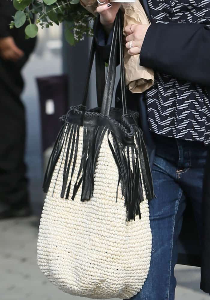 Whitney Port adds a statement fringed bag to her casual look