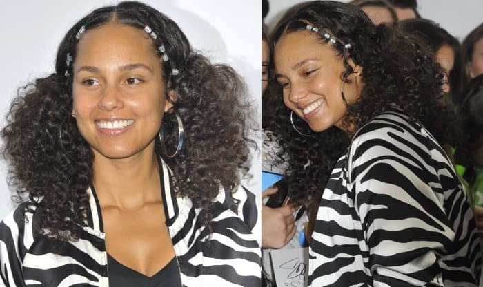 Alicia Keys shines at the WE Day event held at The Forum in Inglewood, California, on April 27, 2017, embracing her natural curls and a bold zebra-print jacket