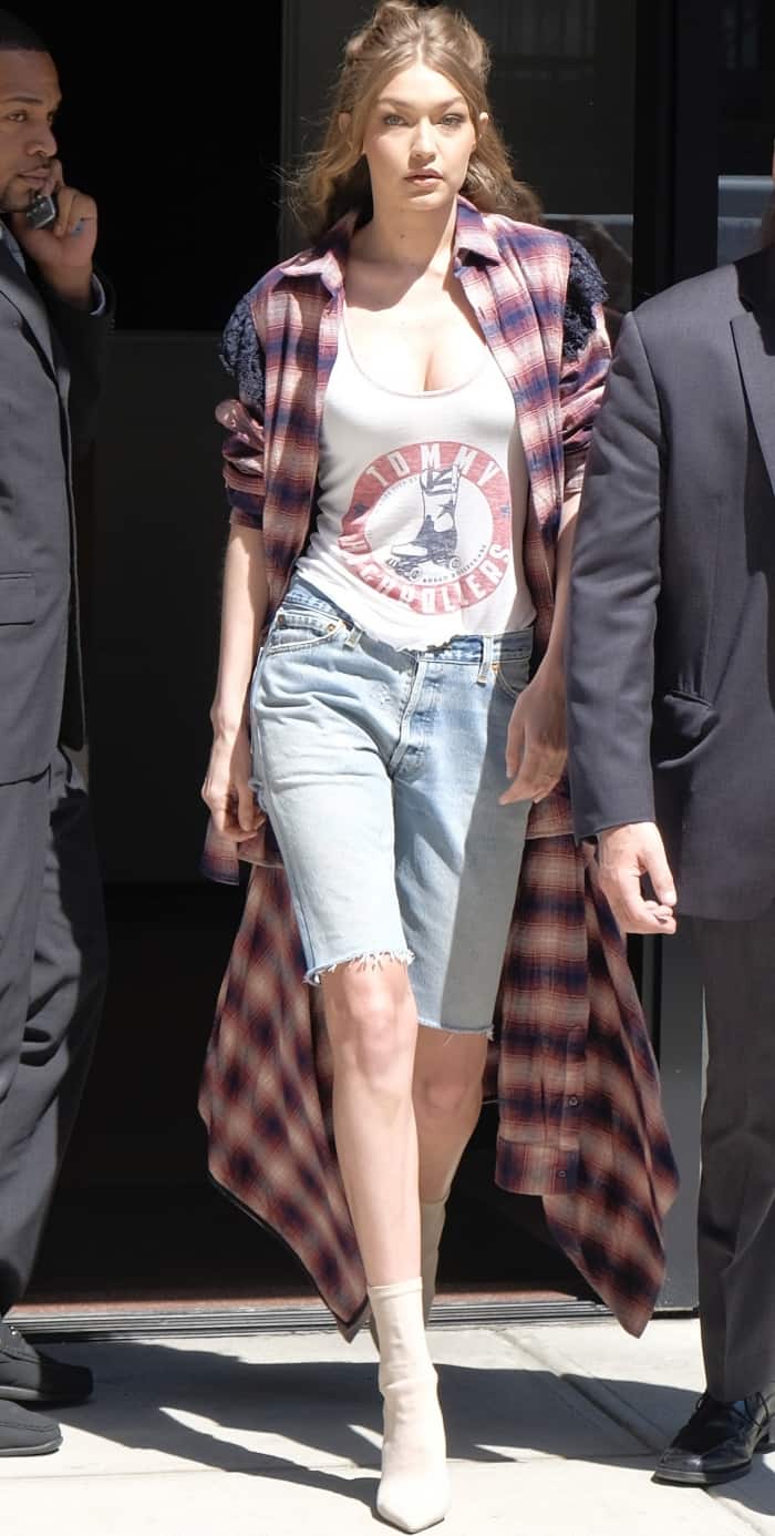 Gigi Hadid, known for her collaboration with Tommy Hilfiger on a fashion collection, wore a revealing Tommy Highrollers top that accentuated her slim figure