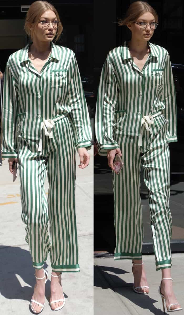 Gigi Hadid wearing a Morgan Lane emerald silk pajama set and Stuart Weitzman "Nudistsong" sandals in NYC