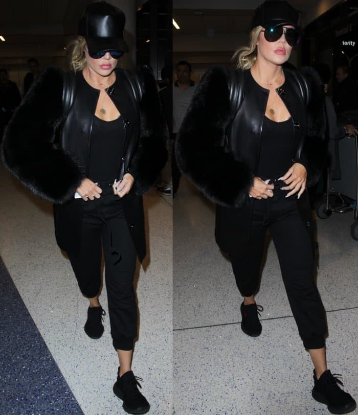 Khloe Kardashian wearing an all-black outfit styled with Yeezy Boost 350 V2 Sneakers at LAX