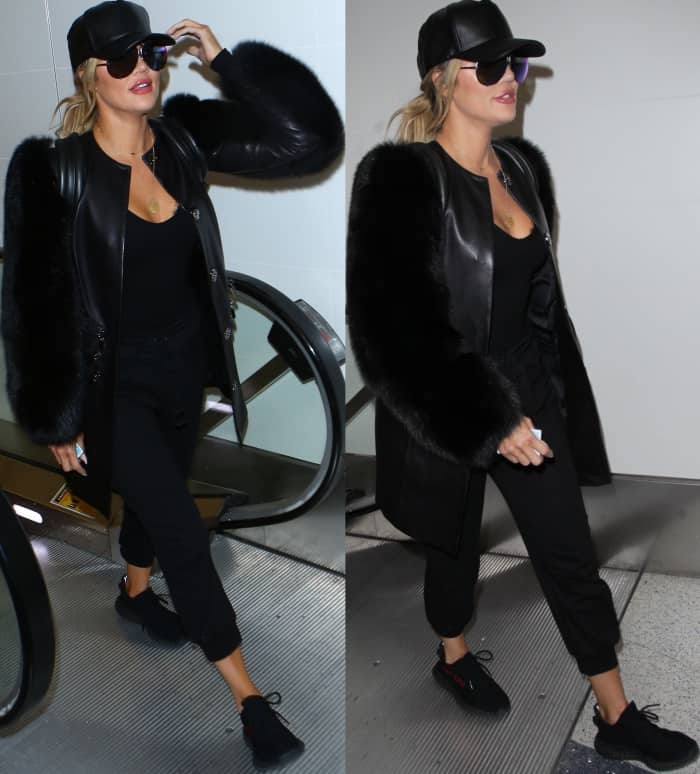 Khloe Kardashian wearing an all-black outfit styled with Yeezy Boost 350 V2 Sneakers at LAX