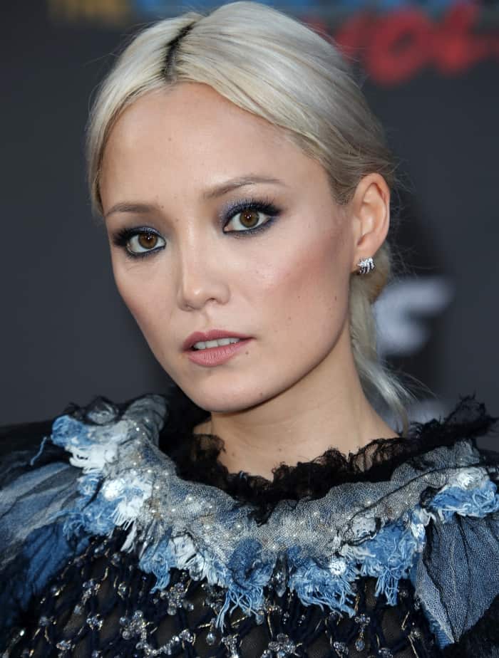 Pom Klementieff wearing a Chanel dress and black ankle-strap sandals at the "Guardians of the Galaxy Vol. 2" world premiere