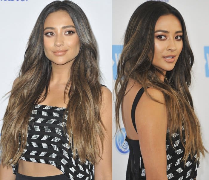 Shay Mitchell exudes effortless glamour at the WE Day event held at The Forum in Inglewood, California, on April 27, 2017, wearing a chic black-and-white Cushnie et Ochs crop top paired with sleek waves and a confident pose