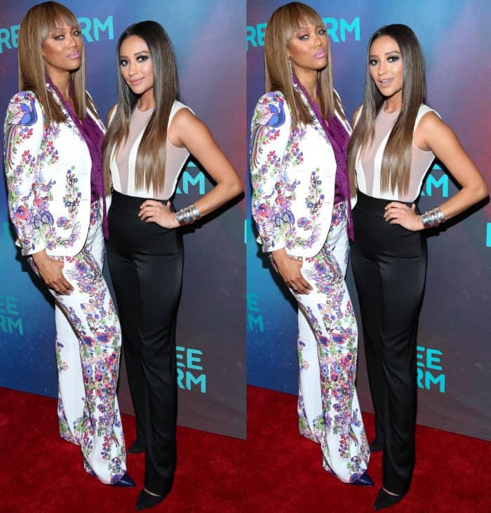 Tyra Banks wearing a Roberto Cavalli resort 2017 ensemble with pointy-toe pumps and Shay Mitchell wearing a Galvan pre-fall 2017 jumpsuit with pointy-toe pumps at the Freeform 2017 Upfront