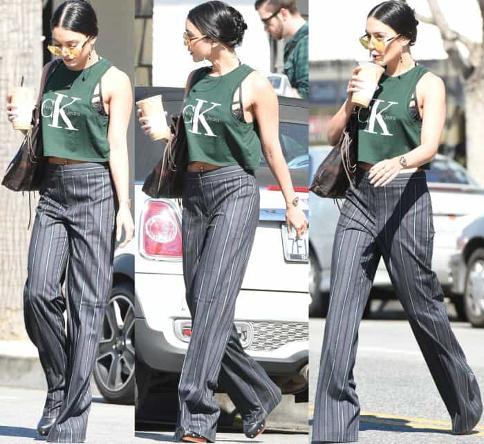 Vanessa Hudgens opted for a dark green cropped tank from Calvin Klein styled with grey striped pants