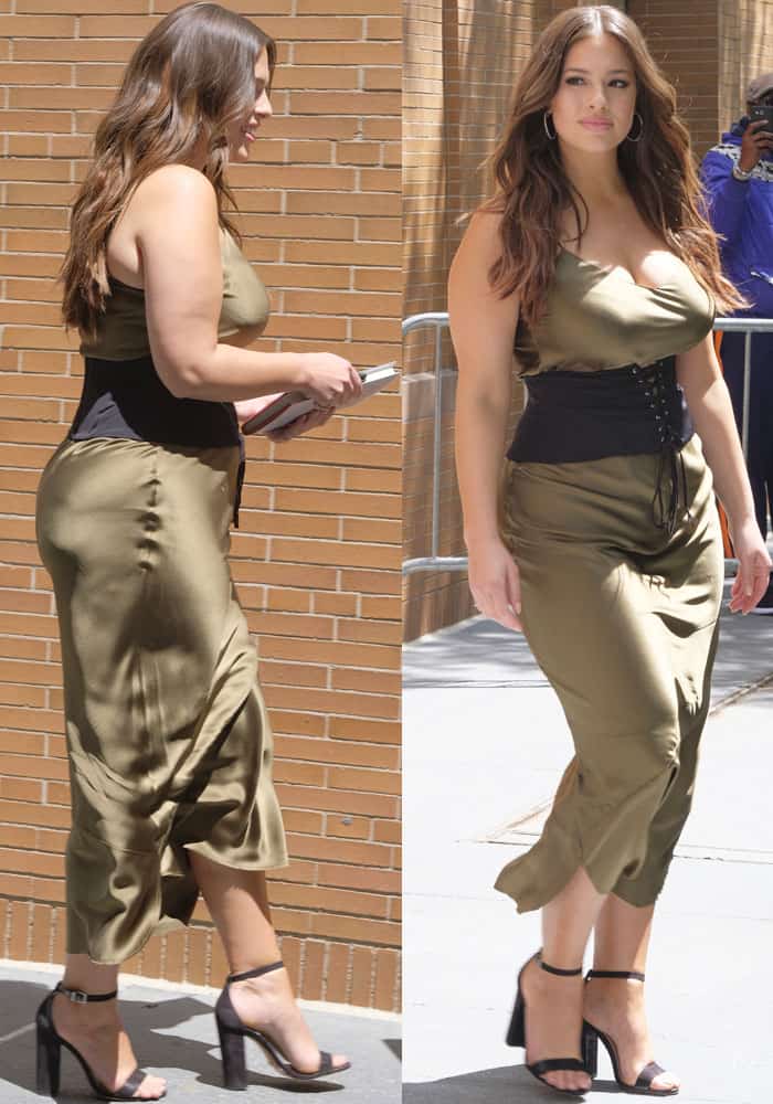 Ashley Graham exuded an alluring '90s vibe by donning Nili Lotan's captivating olive classic slip dress styled with a black Fleur du Mal lace-up corset belt