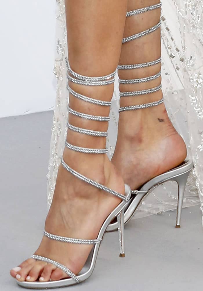 Bella Hadid shows off her sexy feet in glittering sandals