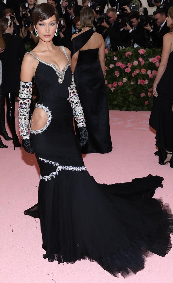 Bella Hadid's black Moschino gown featuring a cutout at the hip at the 2019 Met Gala