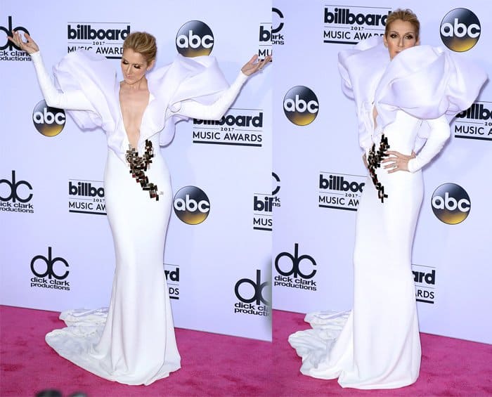 Celline Dion makes a dramatic entrance in white plunging neckline gown with wings