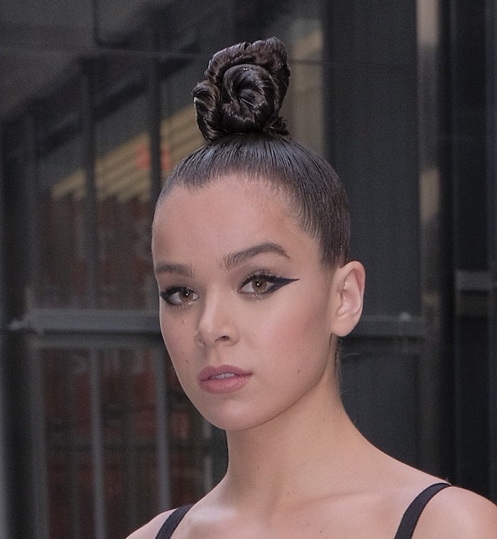She finished with a top knot and dark winged eyeliner
