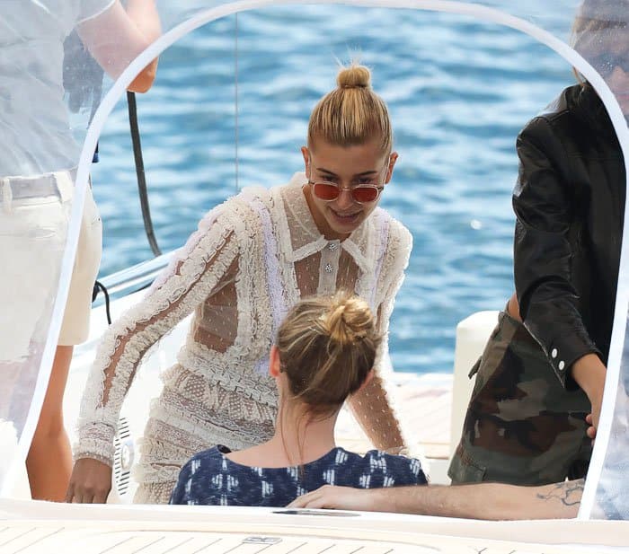 Hailey happily climbs into the boat as she heads towards her next destination