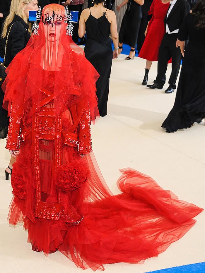 Katy Perry's outfit was a bold veiled design that aimed to embody the spectacle and drama the Met Gala is famed for