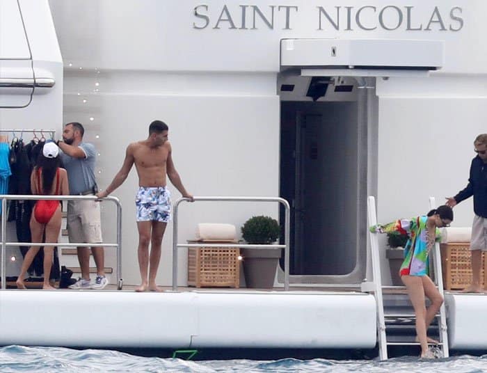 The model takes a dip after boarding Saint Nicolas