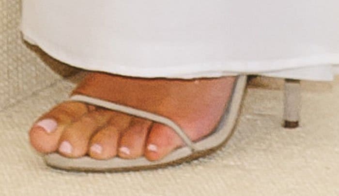 Kim allows a little bit of her Yeezy sandals to peek out