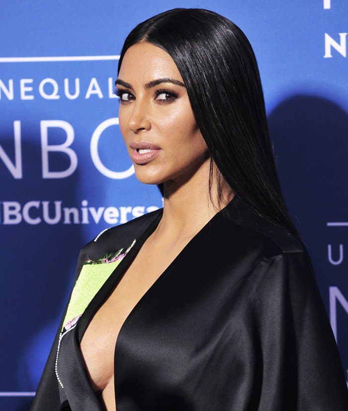 Kim Kardashian wears a satin jacket from British-Cypriot-Turkish fashion designer Hussein Chalayan