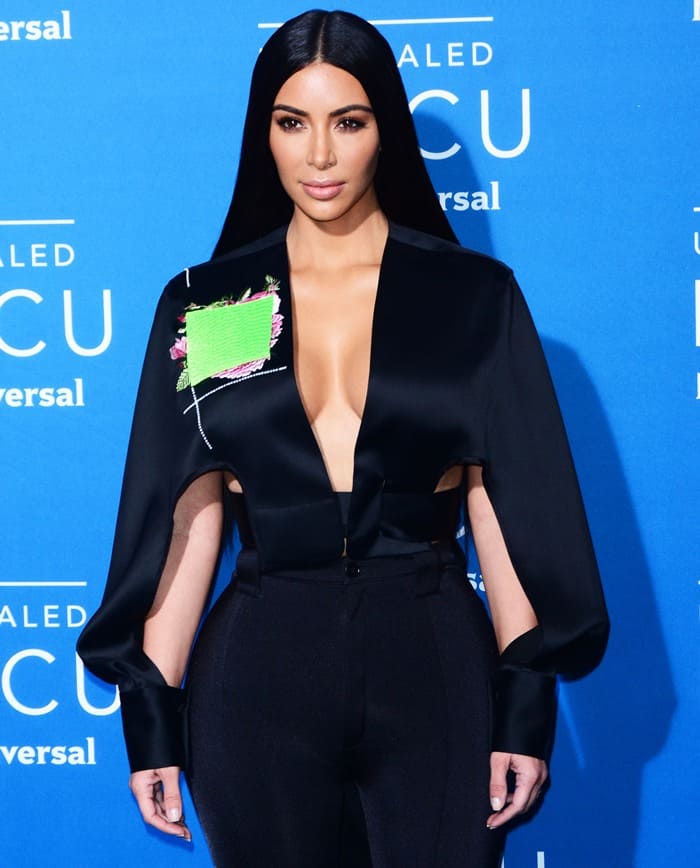 Kim Kardashian's black Chalayan long-sleeve crop top features cutout and embroidery detailing