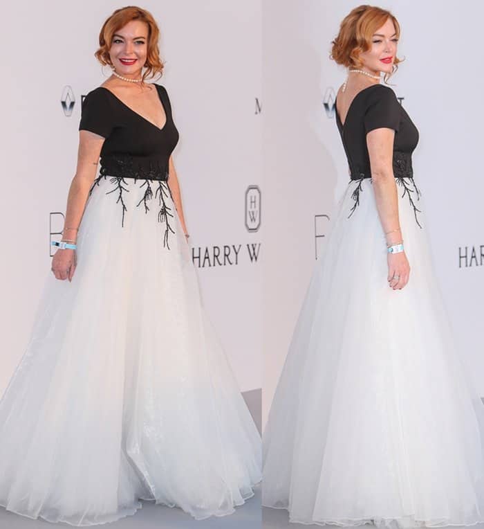 Lindsay Lohan exudes Old Hollywood glamour in a black-and-white Christophe Guillarme gown with intricate embroidery and a classic pearl necklace at the 2017 amfAR Gala