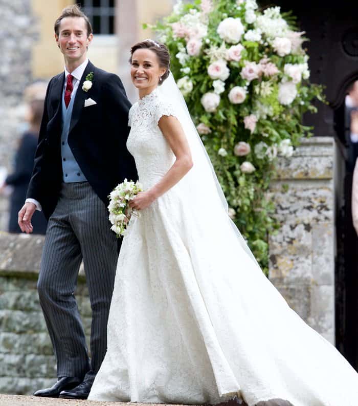 Pippa Middleton beams in her exquisite Giles Deacon lace gown as she exits St. Mark's Church hand in hand with her new husband, James Matthews