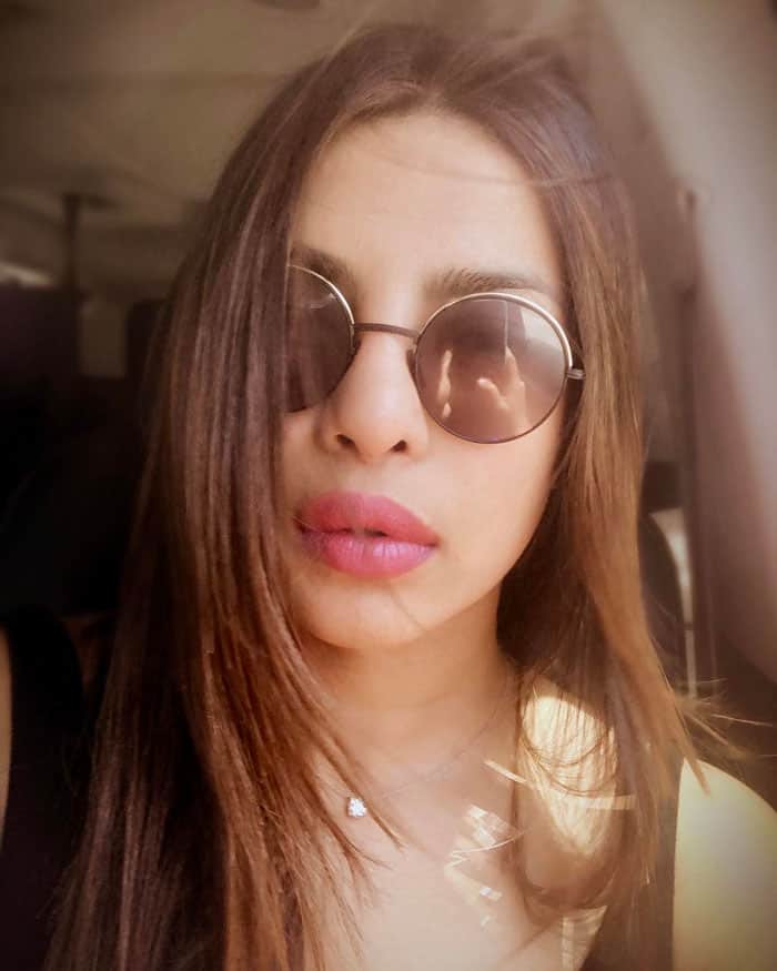 Priyanka takes her first selfie in the car to LAX captioned, "Berlin bound but selfie first. #summertimefeels"