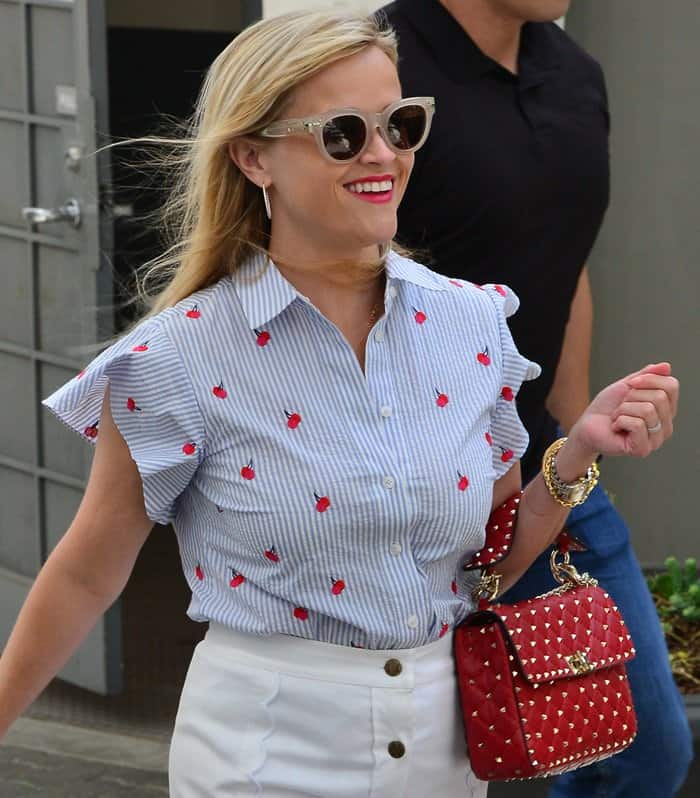 Reese was all smiles for the camera as she was photographed leaving her office
