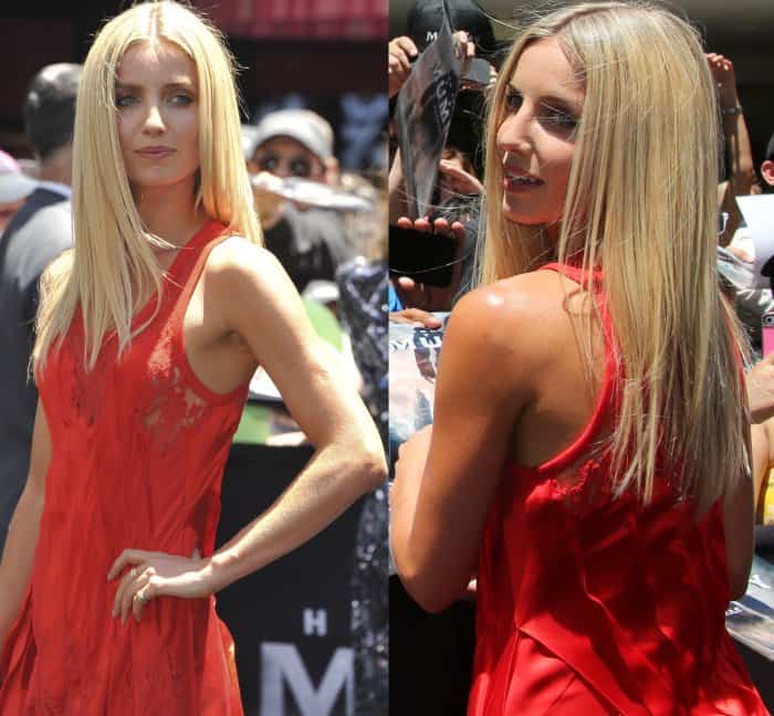 Annabelle Wallis stuns in a fiery red sleeveless Givenchy dress featuring delicate lace panels and a flowing silk satin design