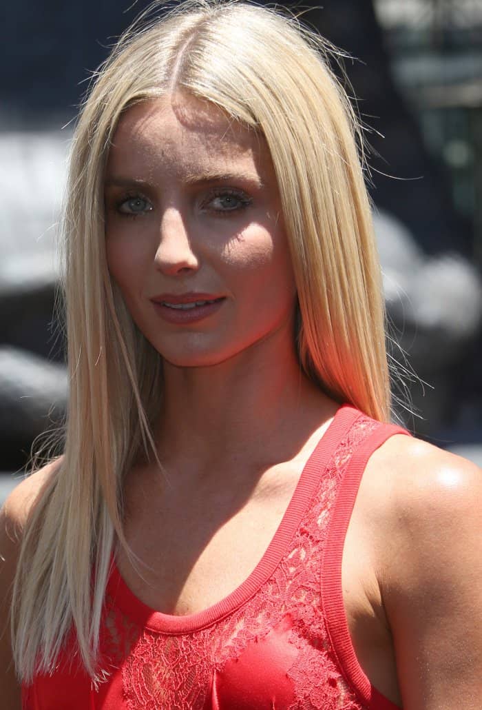 Annabelle Wallis pairs her sleek, center-parted blonde locks with a natural makeup look featuring soft pink lips and subtle eyeliner for a radiant finish