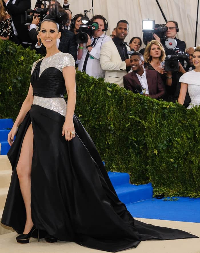 Celine Dion wearing an Atelier Versace gown and Charlotte Olympia pumps at the 2017 Met Gala