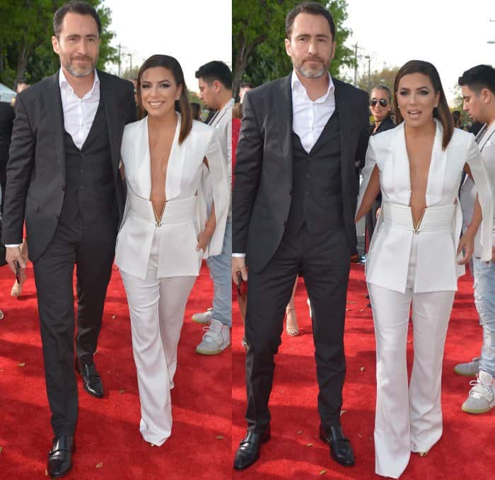 Eva Longoria Bastón's crisp white jumpsuit by Elisabetta Franchi stood out beautifully beside her much taller Lowriders co-star Demian Bichir, who contrasted her look in a dark three-piece suit