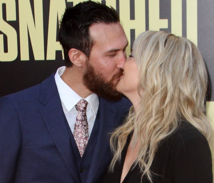 Danny Fujikawa in a navy blue suit and Kate Hudson in a custom look from Michael Kors Collection and Giuseppe Zanotti embellished platform sandals at the LA premiere of "Snatched"