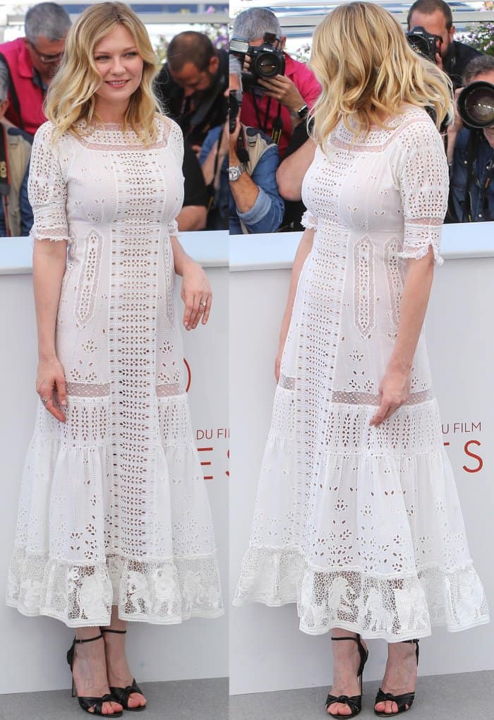 Kirsten Dunst wearing a white Loewe spring 2017 dress and Gucci ankle-strap sandals at "The Beguiled" photocall during the 70th annual Cannes Film Festival