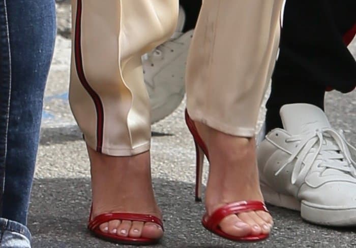 Kourtney Kardashian shows off her feet in Gucci red patent leather sandals