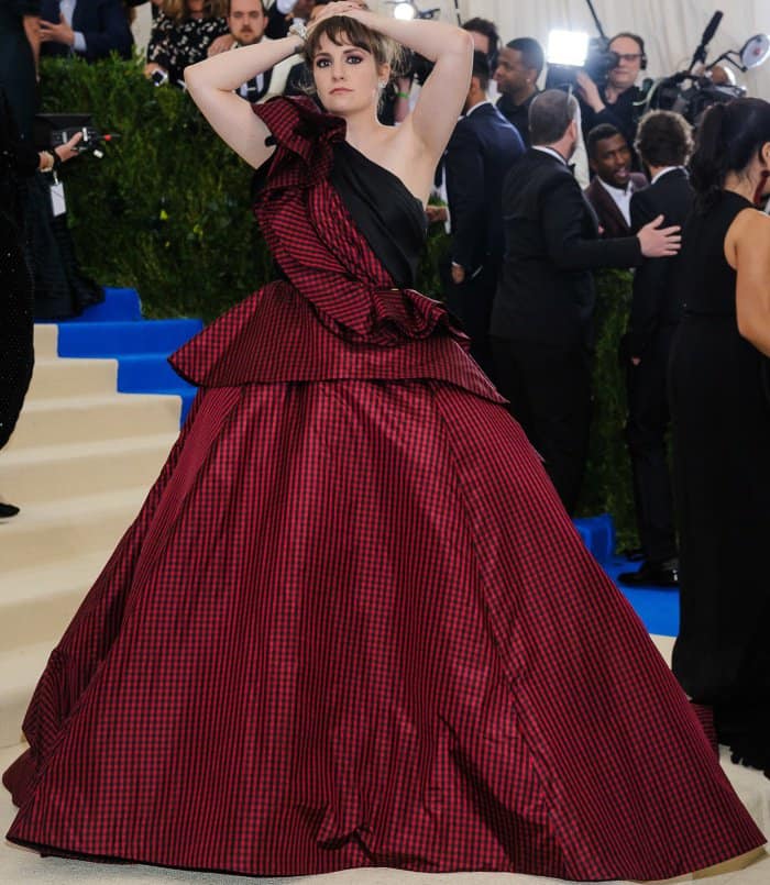 Lena Dunham wearing a custom Elizabeth Kennedy gown and Jeffrey Campbell lace-up boots at the 2017 Met Gala